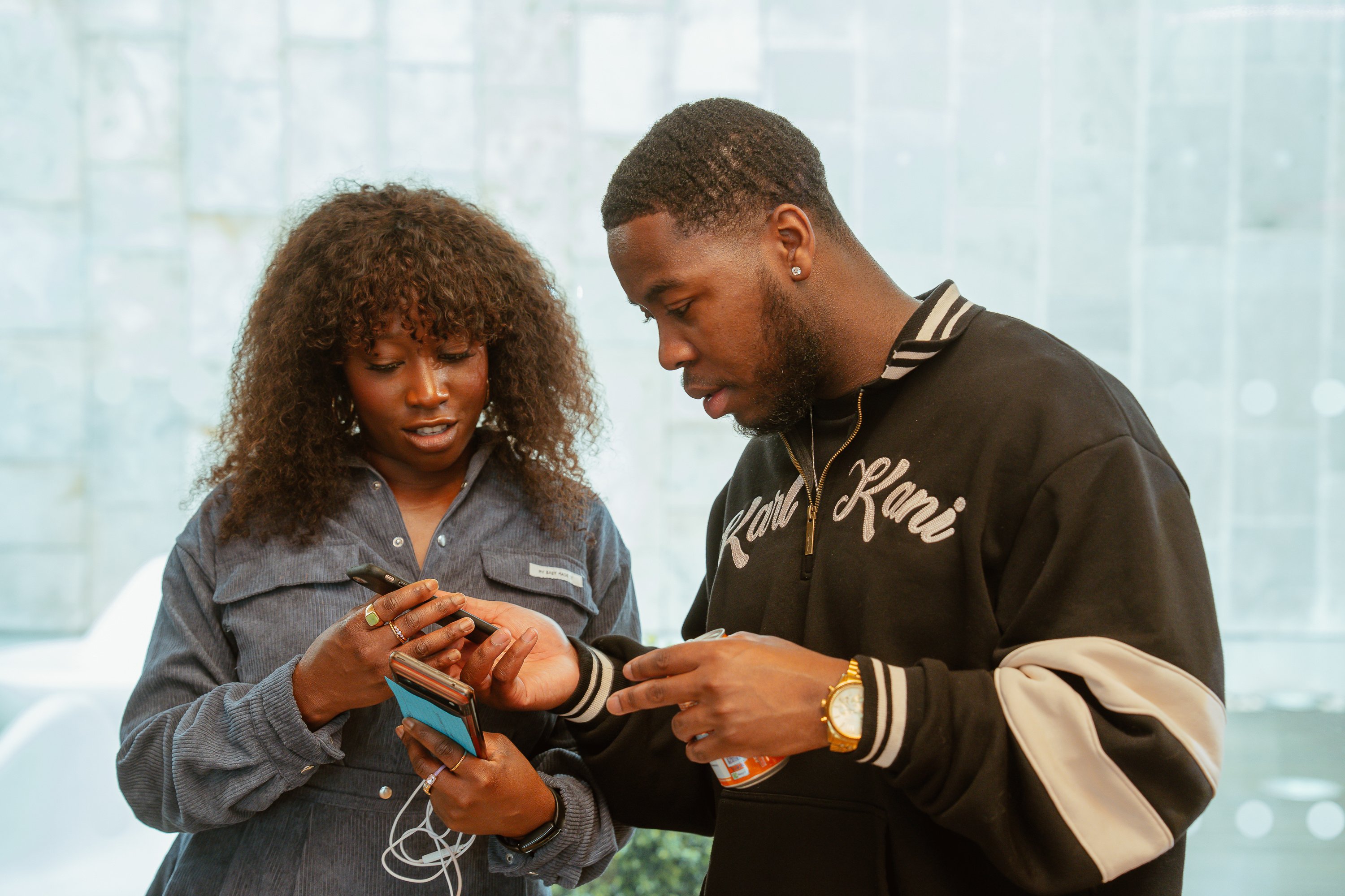 two people looking at a phone