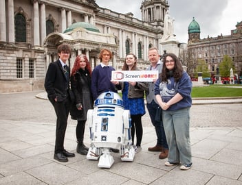 a group of students with R2D2 from Star Wars